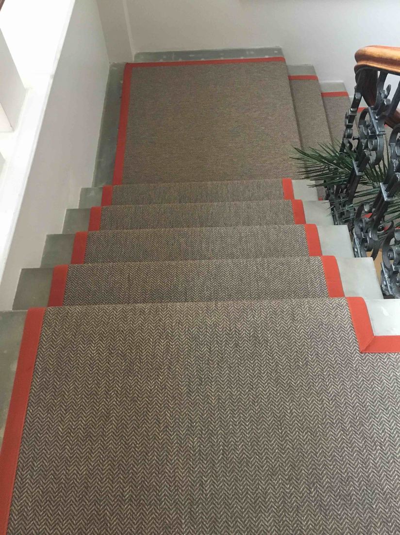 Herringbone stair runner with red border tape