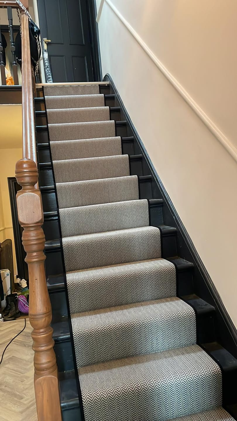 Faux sisal herringbone pattern with whipped edge on stairs