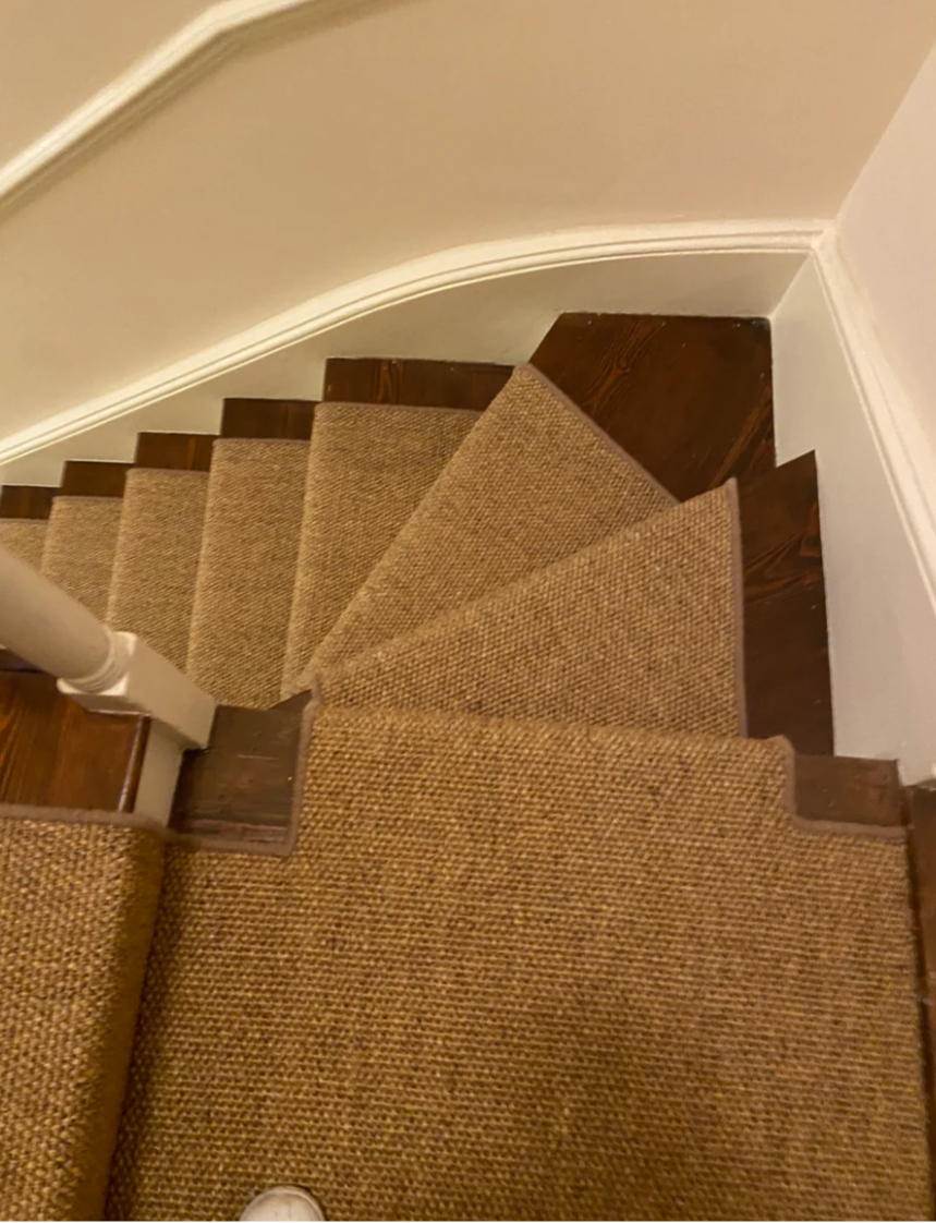 Brown sisal stair runner on stairs