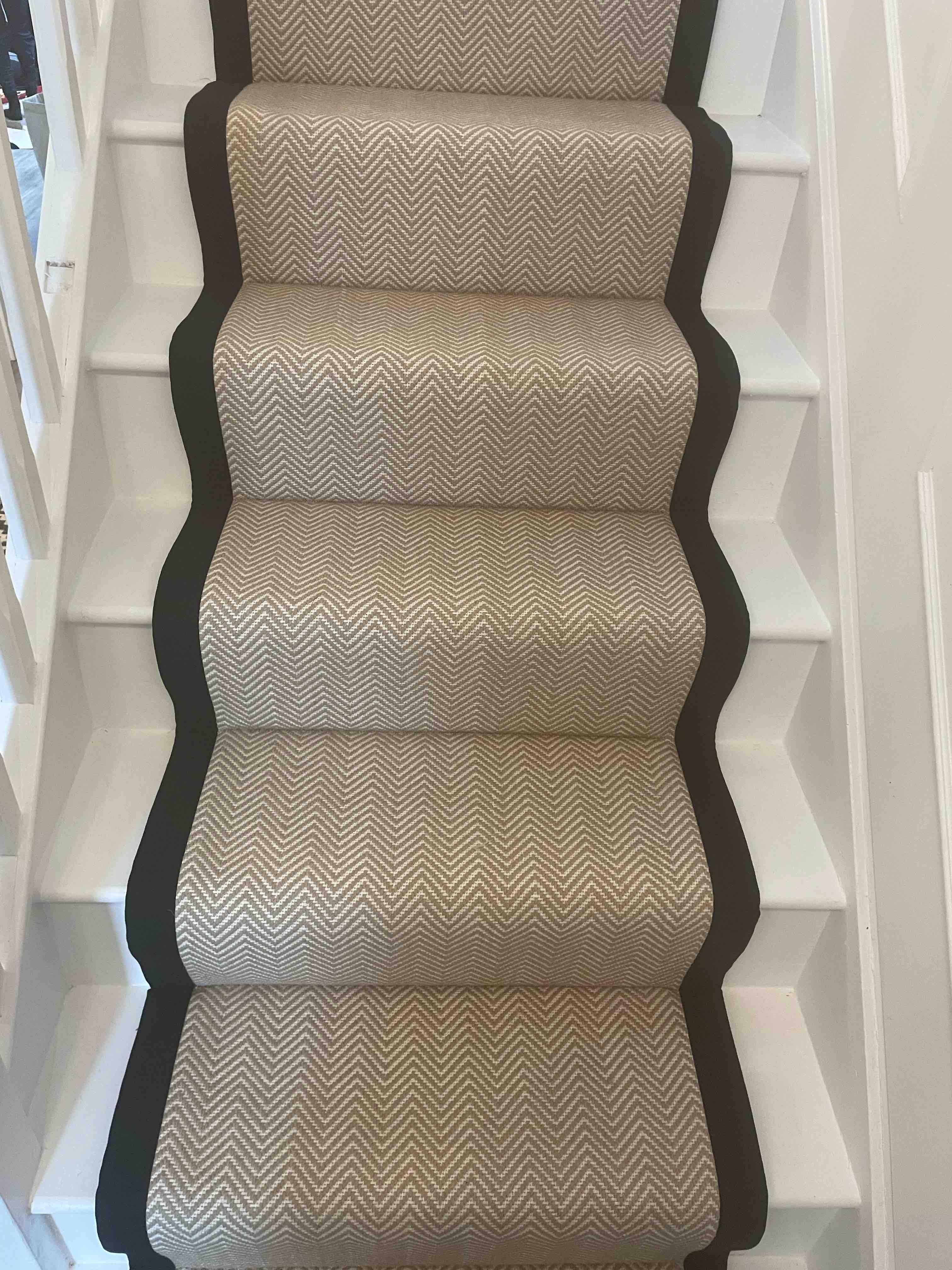 Champagne herringbone stair runner with a brown cotton border