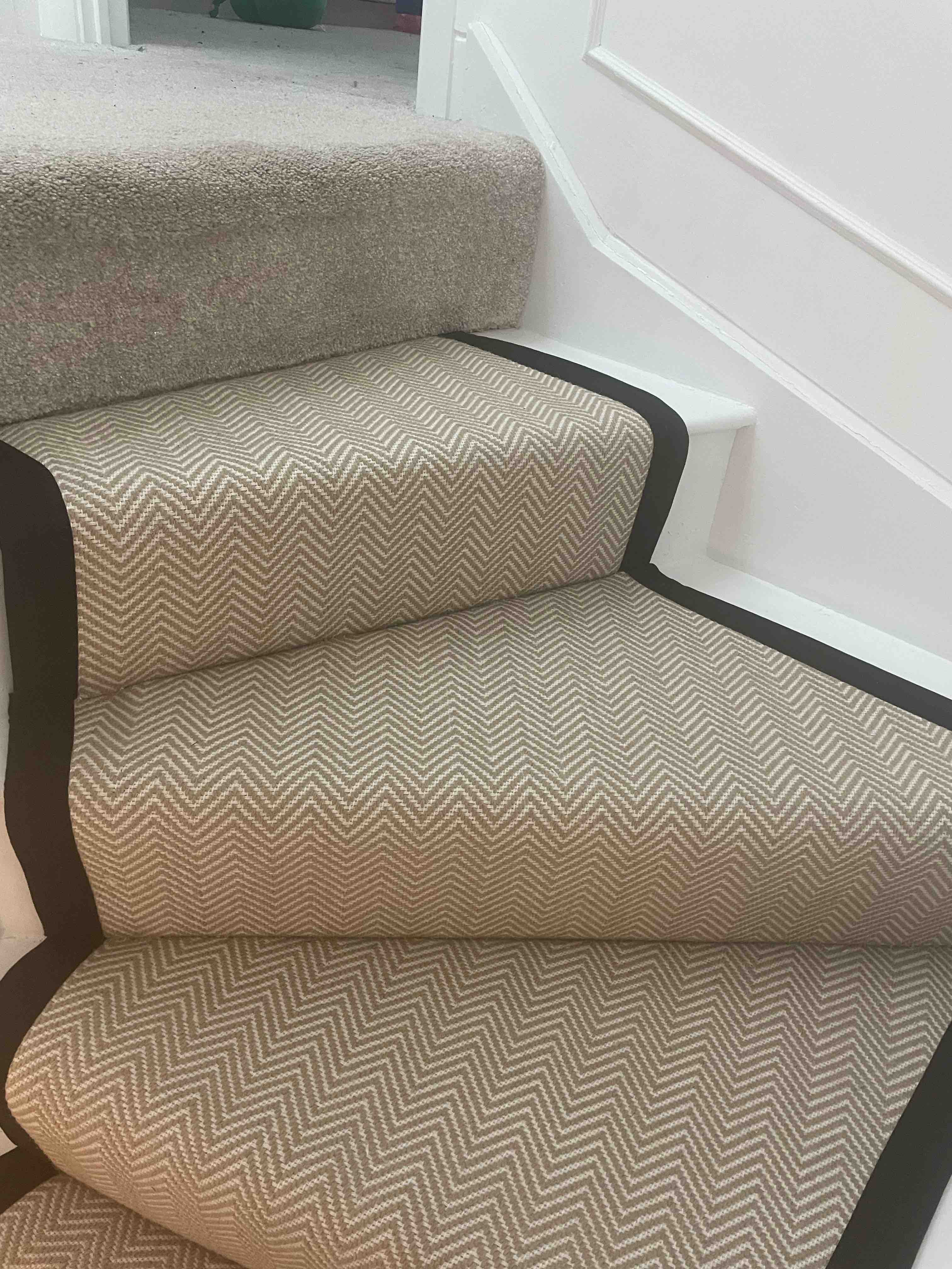 Champagne herringbone stair runner with a brown cotton border