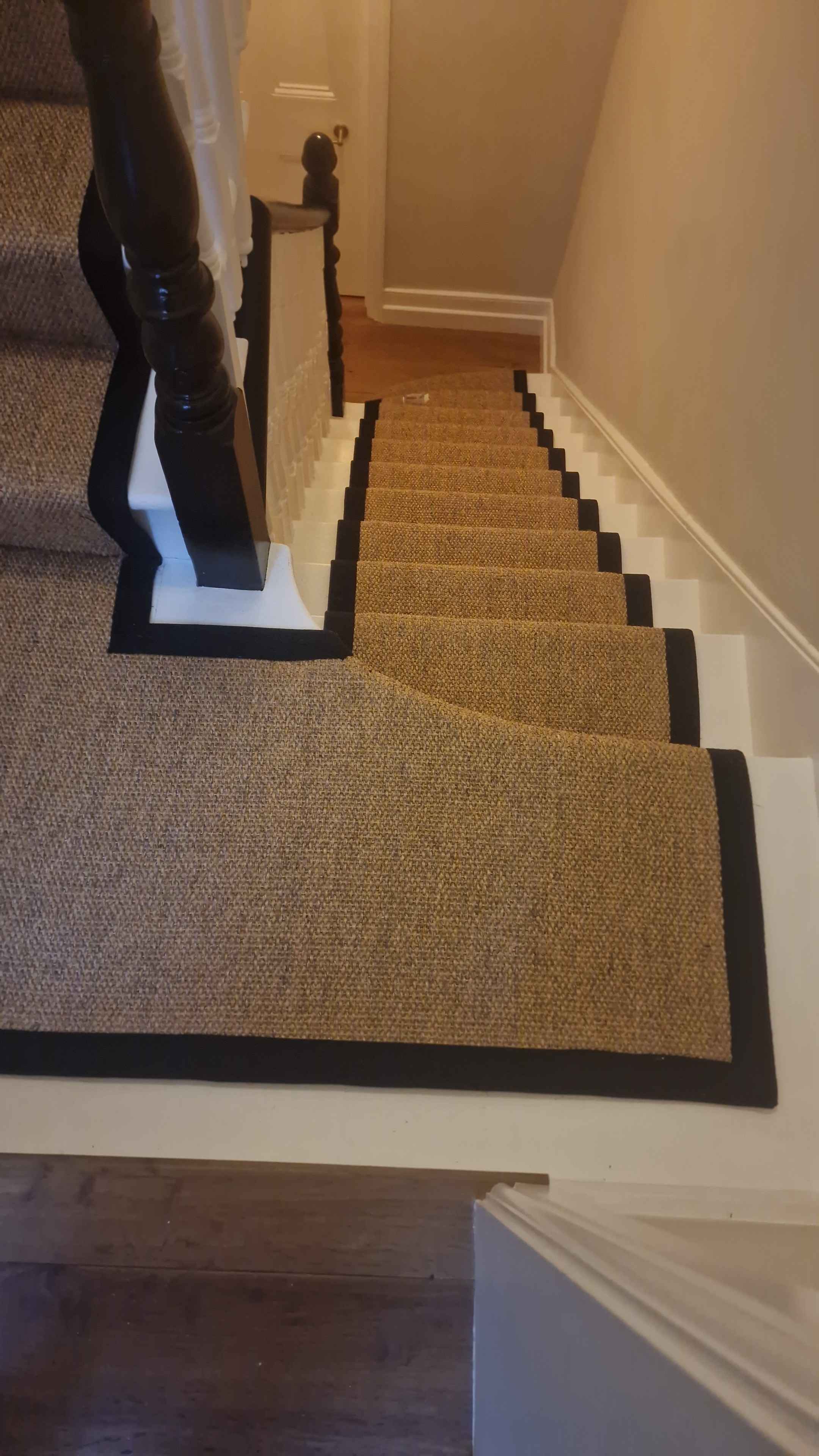 Sisal bouclé stair runner with a black cotton border